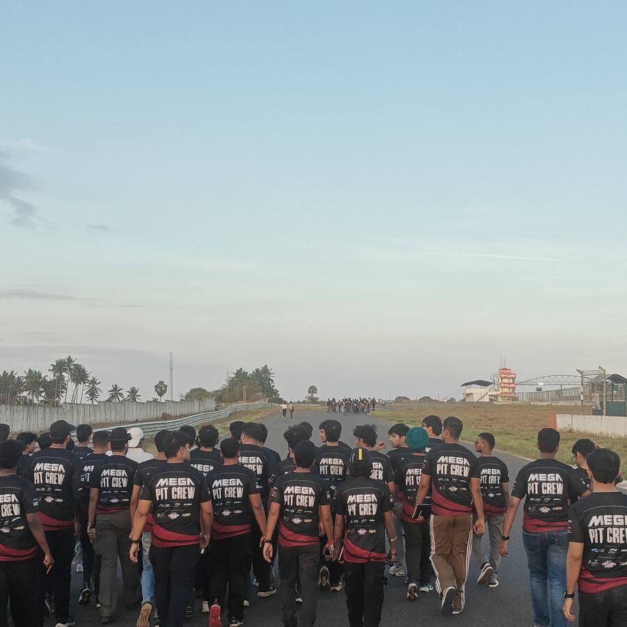 Group walking down the pit straight during the track walk
