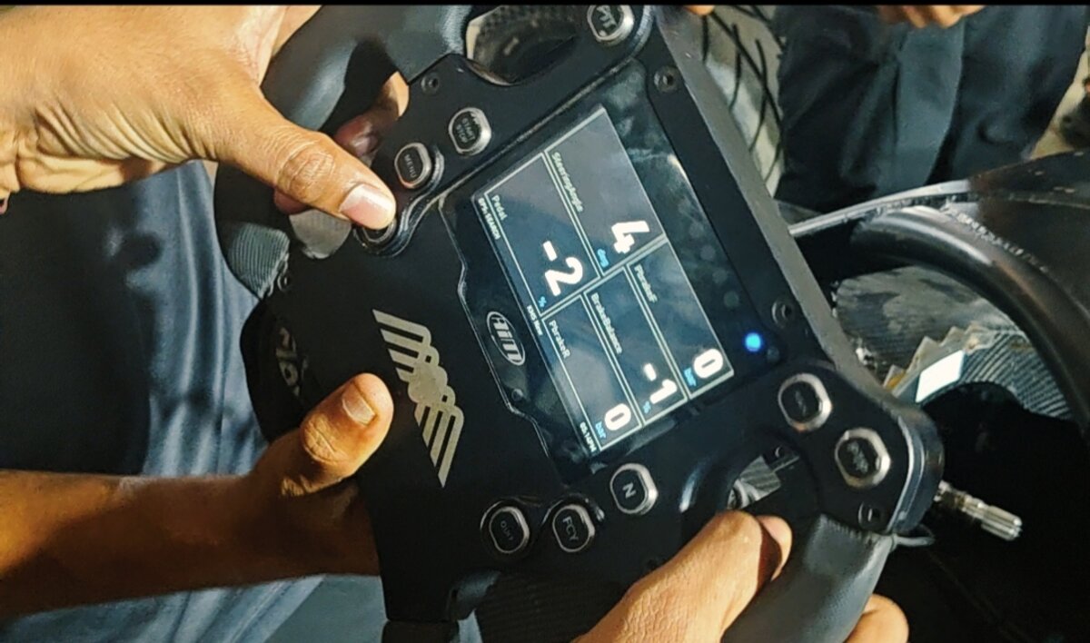 AiM steering wheel telemetry display showing live data channels